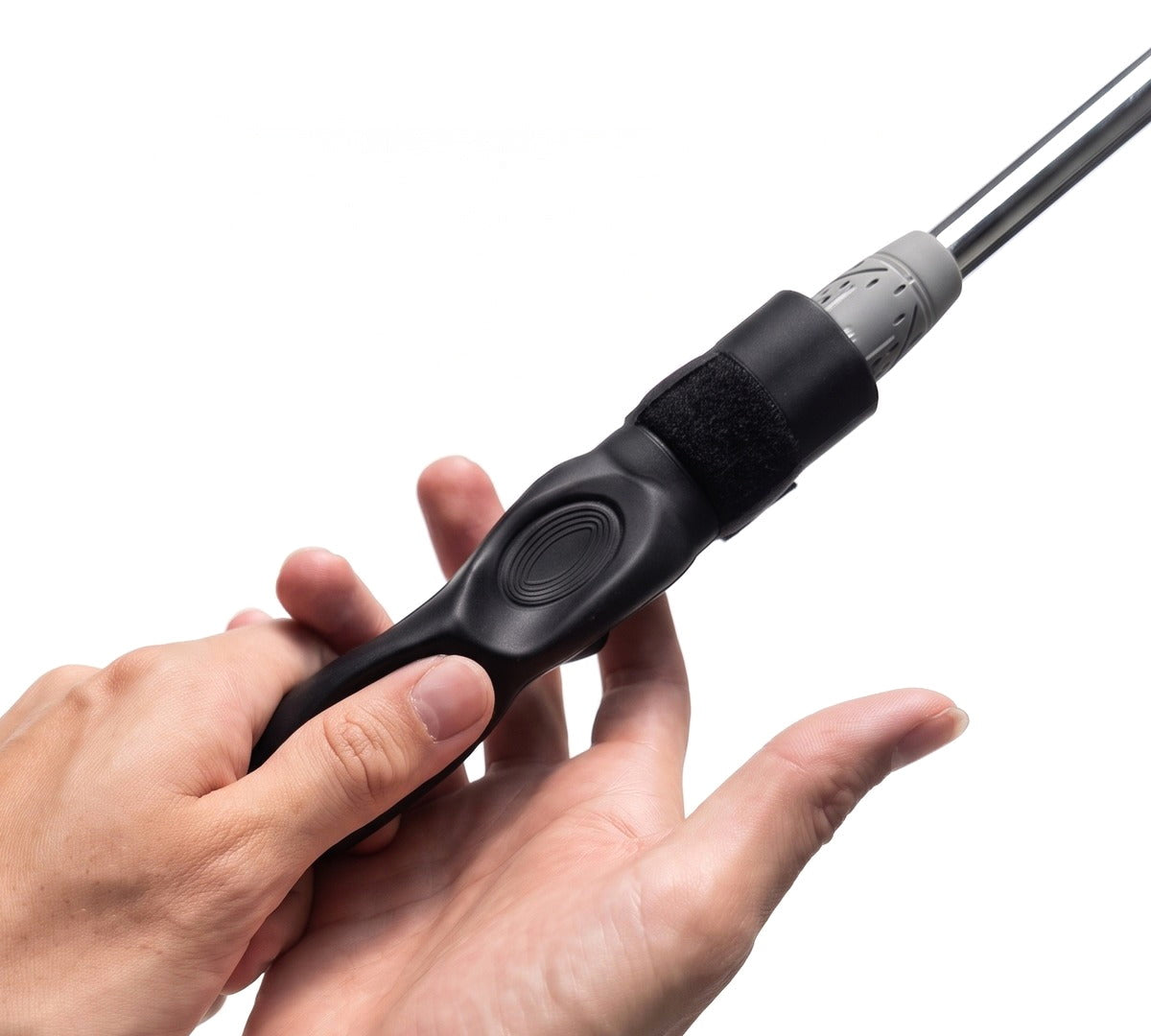 Perfect Grip Attachment clipped onto a golf club, guiding the fingers into position