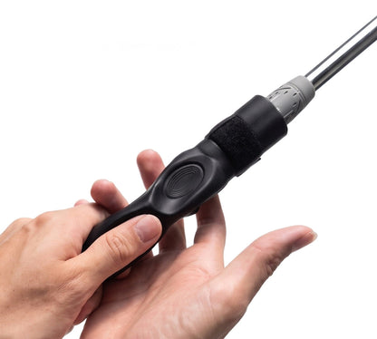 Perfect Grip Attachment clipped onto a golf club, guiding the fingers into position